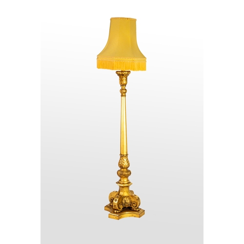 73 - LARGE TURNED AND MOULDED GILTWOOD THREE LIGHT STANDARD LAMP, the tapering column with scrolled flora... 