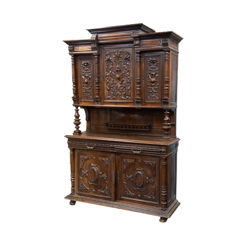 13 - EARLY TWENTIETH CENTURY FRENCH CARVED WALNUT HUNTER’S CUPBOARD, of typical form with stepped, three ... 