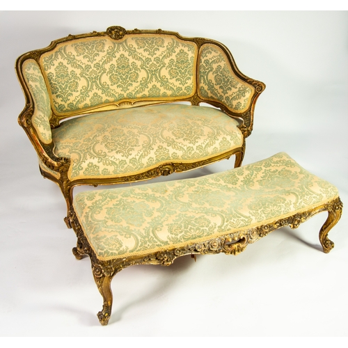 11 - FRENCH CARVED GILTWOOD PARLOUR SOFA, the moulded show wood frame with shell, leaf and floral pendant... 