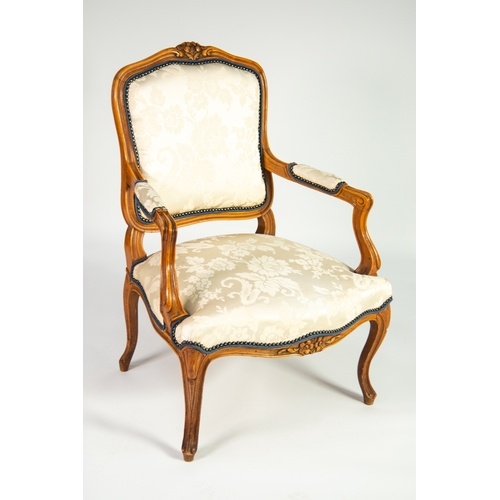 12 - FRENCH CARVED BEECH FAUTEUIL OR OPEN ARMCHAIR, the moulded show wood frame enclosing a padded back a... 