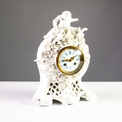 91 - PORCELAIN MANTEL CLOCK: late 19th century French blanc-de-chine mantel clock with cherub crest surmo... 