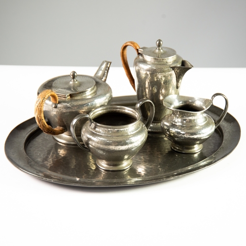 90 - SOLKETS FOUR PIECE PLANISHED ENGLISH PEWTER TEA SET AND THE MATCHING OVAL TRAY, the teapot and hot w... 