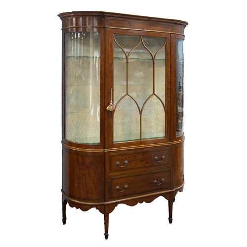 33 - EDWARDIAN LINE INLAID MAHOGANY BOW FRONTED DISPLAY CABINET, the moulded cornice above a plain frieze... 