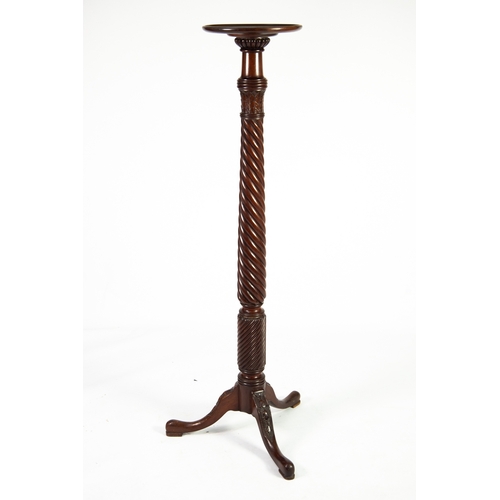 37 - ANTIQUE CARVED MAHOGANY TORCHERE, of typical form with wrythen fluted column and bell flower pendant... 