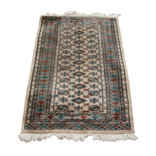 59 - PAKISTAN BOKHARA RUG, closely woven with silky pile, with a trellis pattern joininig three rows of s... 