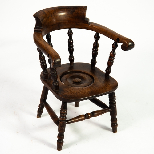 40 - VICTORIAN CHILD'S COMMODE: 19th century child's elm and fruitwood smokers bow Windsor chair commode,... 