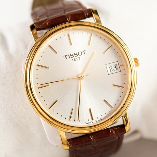 120 - TISSOT SWISS GENTLEMAN'S QUARTZ GOLD-PLATED WRIST WATCH, the circular silvered dial with batons, cen... 