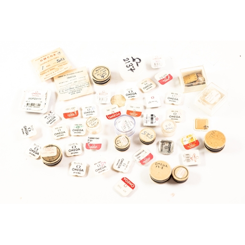 126 - OMEGA WATCH REPAIR PARTS in approximately 45 containers, includes a box of dials and watch movements... 