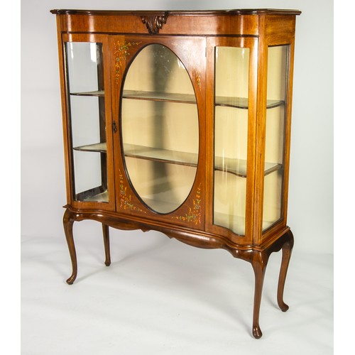 32 - AN EDWARDIAN FLORAL PAINTED SATIN-WALNUT DISPLAY CABINET, THE CENTRE DOOR HAVING A GLAZED OVAL PANEL