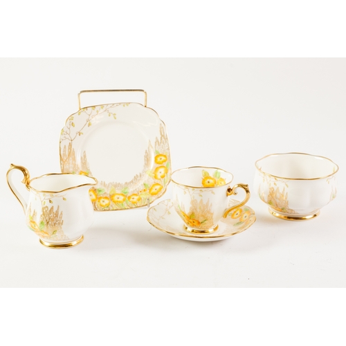 15 - ATTRACTIVE ROYAL ALBERT CHINA TEA SERVICE FOR TWELVE PERSONS, yellow flowers on gilt, complete with ... 