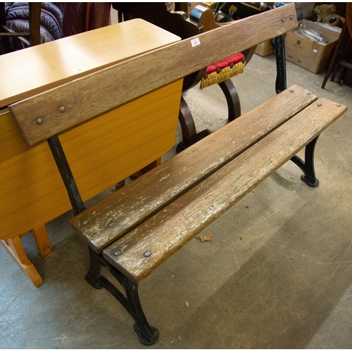 370 - A THREE-PLANK GARDEN BENCH WITH CAST IRON END SUPPORTS