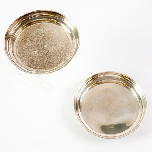 539 - WINE COASTERS: A pair of small solid silver coasters marked Birmingham 1972 by Barker Ellis Silver C... 