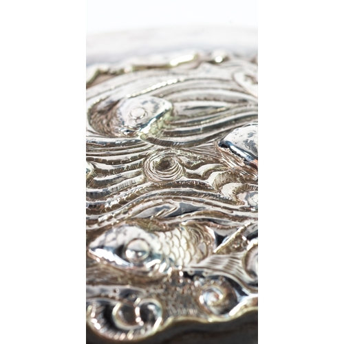 545 - LIDDED BOXES: two 1880s silver lidded boxes: one a soap box with repoussé fish amongst waves decorat... 