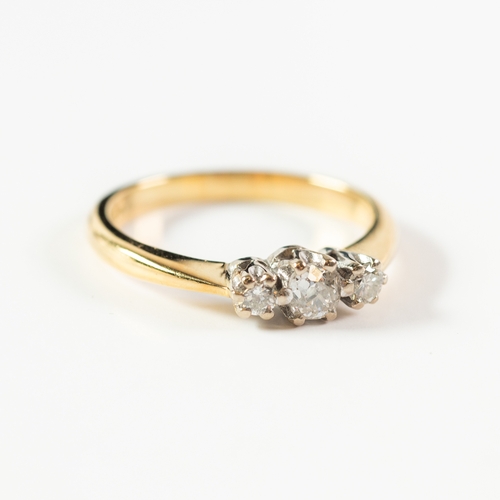 138 - 18ct GOLD RING, claw set with a centre diamond and two smaller side diamonds, centre stone approxima... 