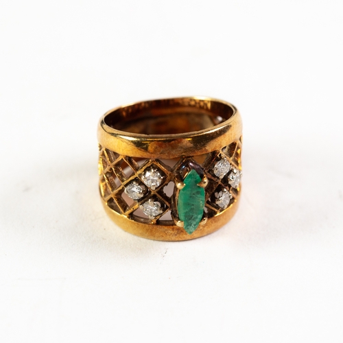 129 - 14k BROAD COCKTAIL RING mostly trellis pierced, the top claw set with a marquise shaped emerald and ... 