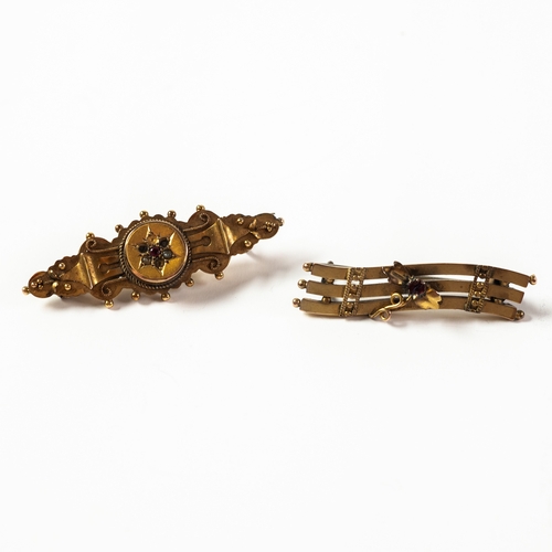 94 - EDWARDIAN 9ct GOLD WING-SHAPED BROOCH, the centre with a star set cluster with a red stone and two s... 