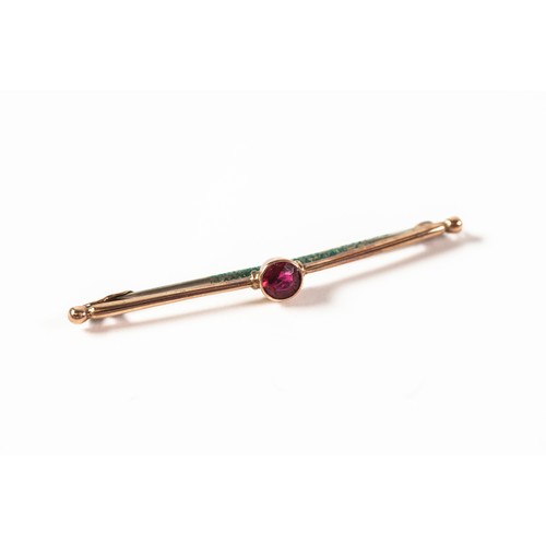 102 - 9ct GOLD BAR BROOCH collet set with centre red stone, metal pin, 1.5gms gross