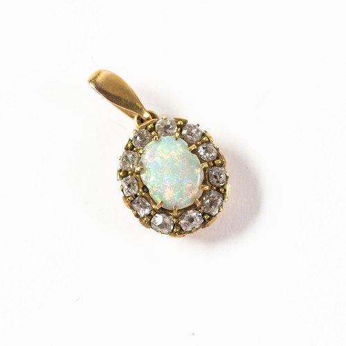 103 - VICTORIAN OPAL AND DIAMOND OVAL CLUSTER PENDANT, claw set with a centre opal and surround of twelve ... 