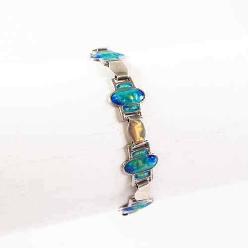 69 - A PANEL LINK BRACELET, each link marked 'Sterling Silver', alternate links plain or blue enamelled