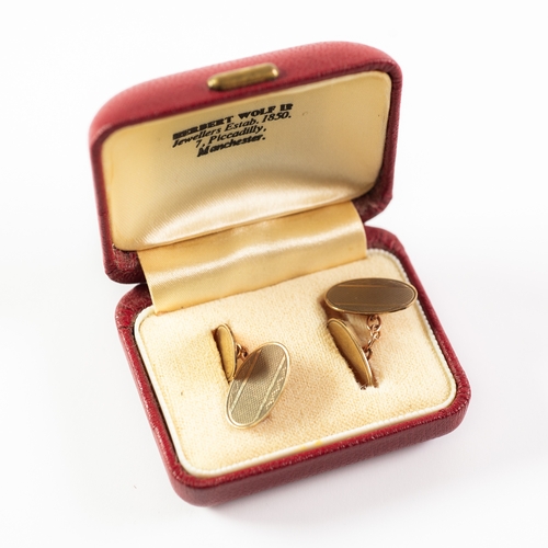 137 - PAIR 9ct DOUBLE OVAL CUFF LINKS, one each with engine turned decoration, 3.6gms, in a Herbert Wolf -... 