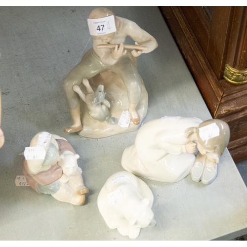 47 - FOUR LLADRO FIGURES, BOY WITH PUPPY AND FLUTE; INUIT WITH BEAR; POLAR BEAR AND A GIRL WITH SLIPPERS ... 