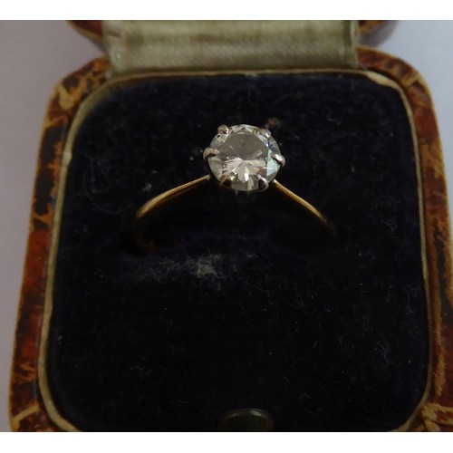 124 - 18ct GOLD RING, with a round brilliant cut diamond in a six claw setting, approximately .45ct, 2gms