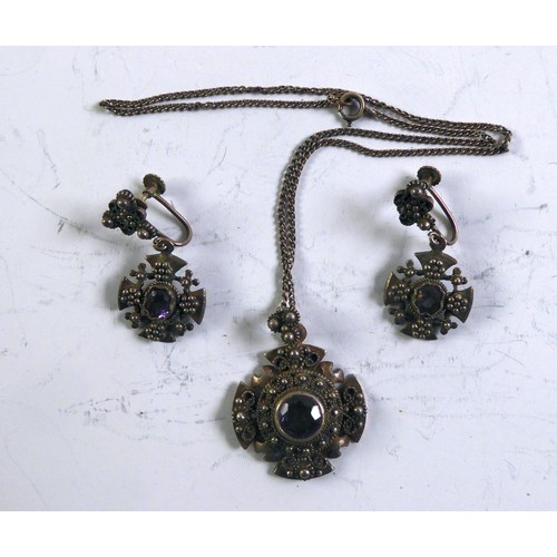 443 - JERUSALEM SILVER COLOURED METAL (935 mark) MALTESE CROSS STYLE PENDANT, collet set with a colour cha... 