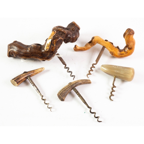 198 - TWO VINTAGE CORKSCREWS WITH NATURAL GNARLED ROOT WOOD HANDLES, one with metal label 'Caves 