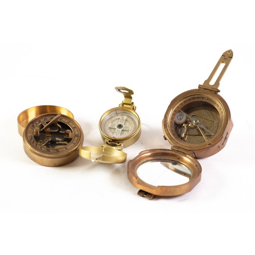 79 - REPRODUCTION OF A STANLEY MK1 BRASS SIGHTING COMPASS, with two interior bubble levels, together with... 