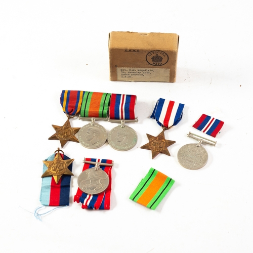 30 - THREE WORLD WAR II MEDALS WITH RIBBONS ON A METAL BROOCH, viz, 1939-45 War Medal, Defence Medal and ... 