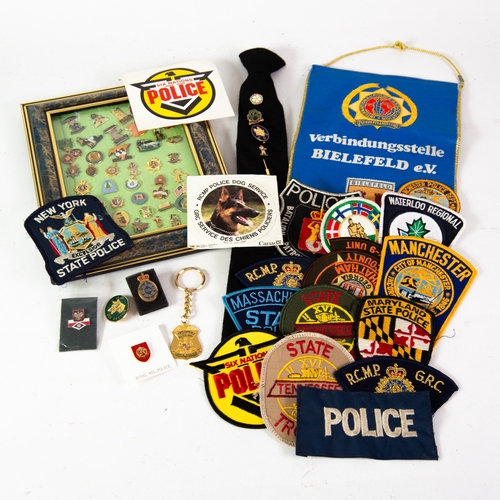 204 - COLLECTION OF MAINLY MODERN GILT METAL AND ENAMEL UK & WORLD POLICE RELATED BADGES AND BUTTONHOL... 