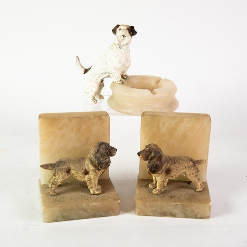 184 - PAIR OF CIRCA 1930's ALABASTER BOOK ENDS, mounted with cold painted figures of standing cocker spani... 