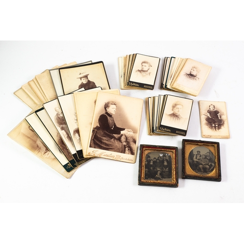 63 - TWO VICTORIAN AMBROTYPE PHOTOGRAPHS, viz, a group of three farm labourers in gilt metal and card fra... 