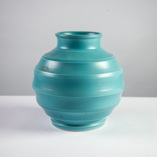 22 - KEITH MURRAY FOR WEDGWOOD TURQUOISE GLAZED MOULDED POTTERY VASE of orbicular, footed form with short... 