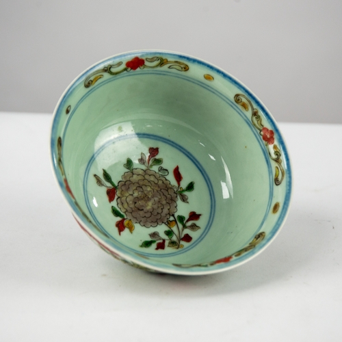 134 - MODERN CHINESE ENAMELLED PORCELAIN BOWL, of footed form, decorated in colours with phoenix amongst f... 