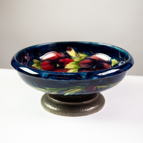 41 - TUDRIC-MOORCROFT POTTERY CIRCULAR FRUIT BOWL, the William Moorcroft bowl decorated with pansies on a... 