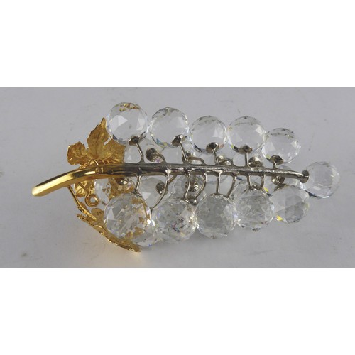 227A - SWAROVSKI MODEL OF GRAPES ON A LEAFY GILT METAL STALK, 6” (15.2cm) long, in original tube box,