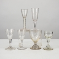 COLLECTION OF SIX ANTIQUE DRINKING GLASSES, including a RUMMER, wheel ...