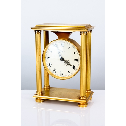 62 - LATE TWENTIETH CENTURY IMHOF GILT METAL ‘STRIKING’ PORTICO MANTEL CLOCK, the 5” Roman dial housed in... 