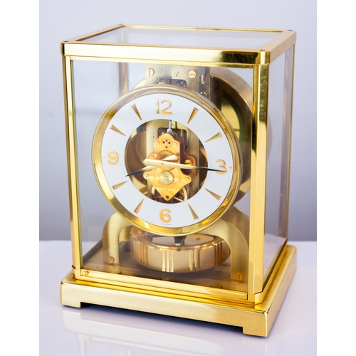 63 - LATE TWENTIETH CENTURY JAEGAR-LECOULTRE GILT METAL CASED ATMOS MANTEL CLOCK, the 4 ¼” white chapter ... 