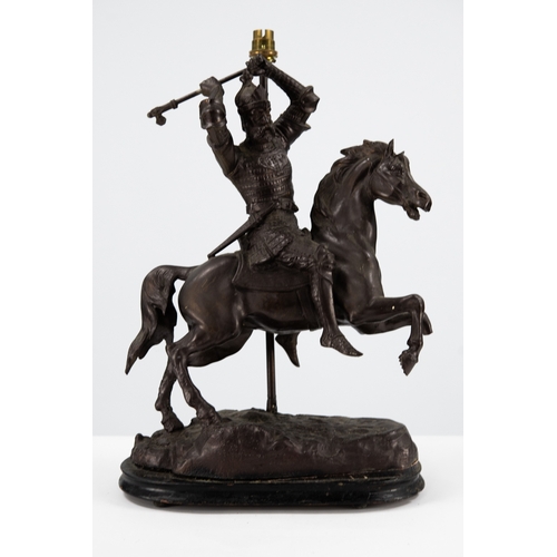 129 - PATINATED SPELTER FIGURAL TABLE LAMP, modelled as a knight on horse back holding an axe above his he... 