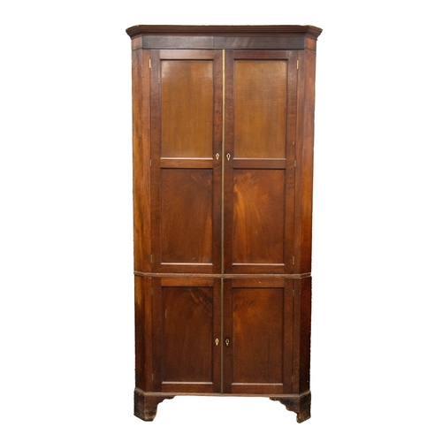 188 - GEORGE III FIGURED MAHOGANY DOUBLE FLOOR STANDING CORNER CUPBOARD, the moulded cornice above a pair ... 