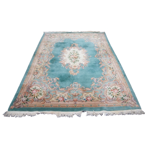 29 - LARGE WASHED CHINESE CARPET with embossed Aubusson design with large cream, light brown and floral o... 