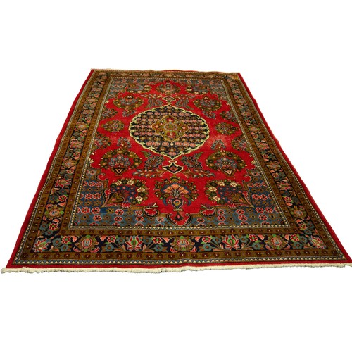 23 - KASHAN STYLE EASTERN CARPET with large centre midnight blue and floral centre medallion with pendant... 