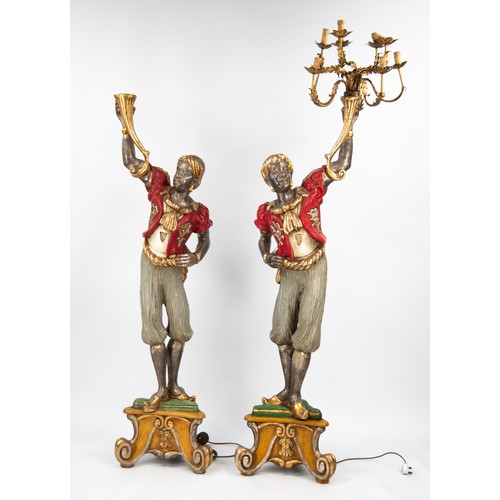 139 - MODERN PAIR OF CARVED WOOD AND POLYCHROME PAINTED BLACKAMOOR TYPE FLOOR LAMPS, each modelled in stan... 