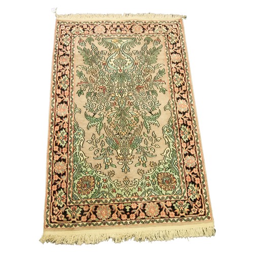 20 - MODERN EASTERN RUG with mihrab, the mauve field filled by a large flowering shrub in a two handled u... 