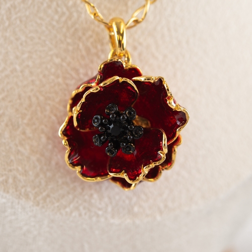 100 - BILL SKINNER GOLD PLATED CHAIN NECKLACE and GOLD PLATED AND RED ENAMELLED FLORAL PENDANT, in associa... 