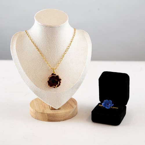 100 - BILL SKINNER GOLD PLATED CHAIN NECKLACE and GOLD PLATED AND RED ENAMELLED FLORAL PENDANT, in associa... 