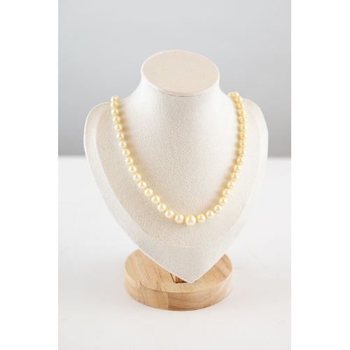 110 - SINGLE STRAND NECKLACE OF GRADUATED CULTURED PEARLS with silver and marcasite clasp, 18