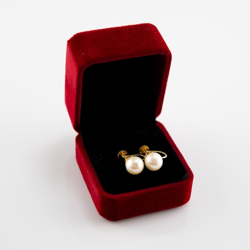 75 - PAIR OF 9ct GOLD SCREW EARRINGS, each cup set with a solitaire pearl